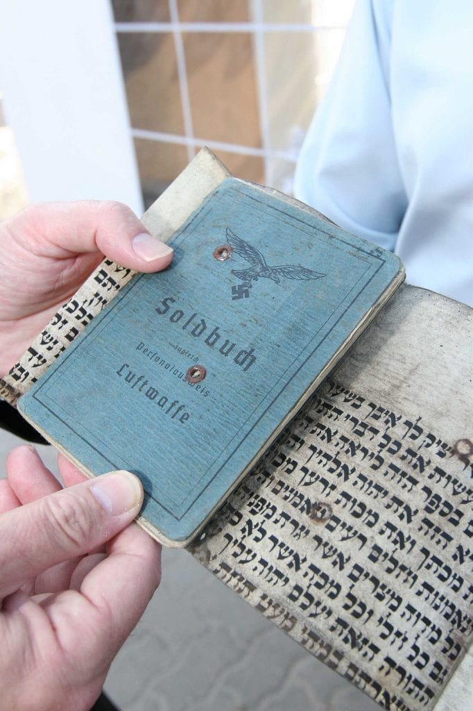 Parchment and ID document (Photo: Courtesy Migdal Ohr)