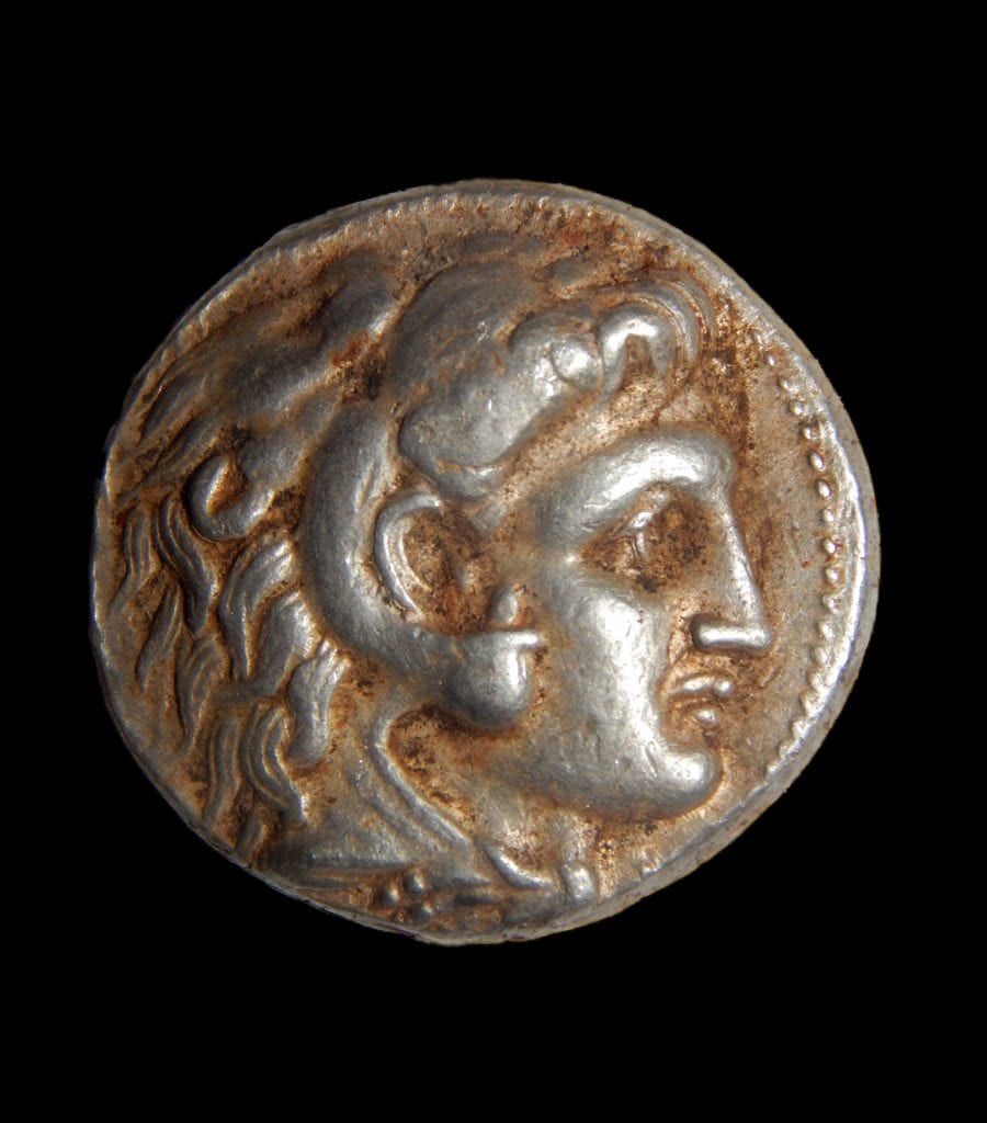 A coin of Alexander of Macedon that was part of the silver cache. (Photo: Shmuel Magal/ IAA)