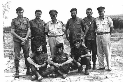 Ariel Sharon (top row, second on left) with his unit headed by Moshe Dayan. (Photo: Facebook)