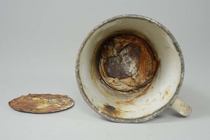 Auschwitz mug with gold ring. (Photo credit: Miroslaw Maciaszczyk/JNi Media)