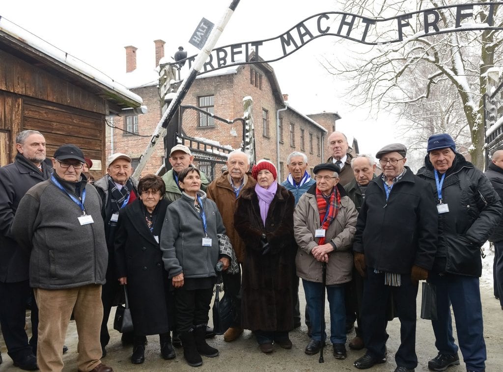 Holocaust survivors return to visit Auschwitz to mark this year's 70 years of liberation. (left to right) Robert Singer, CEO of the World Jewish Congress; Natan Grossman (Germany); Samuel Beller (US); Florence Sprung (US); Manny Buchman (US); Mascha Schainberg (South Africa); Marcel Tuchman (US); Rose Schindler (US); Jonny Pekats (US); Henry Korman (Germany); Ronald Lauder; Mordechai Ronen (Canada); Joseph Madrowitz (US); Edgar Wildfeuer (Argentina). (Photo: Shahar Azran)