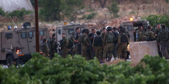sraeli soldiers seen in the Palestinian village of Halhul, near the West Bank city of Hebron. The bodies of three young Jewish teenagers Eyal Yifrach, Naftali Fraenkel and Gilad Sha'ar were found in a field north of Hebron earlier this evening. The three teenagers had been missing since June 12, while hitchhiking in the West Bank, and were presumed to have been abducted by terrorists. Israeli authorities had a few days ago named two Hamas members as prime suspects in the terror attack. June 30, 2014. (Photo: Nati Shohat/FLASH90)