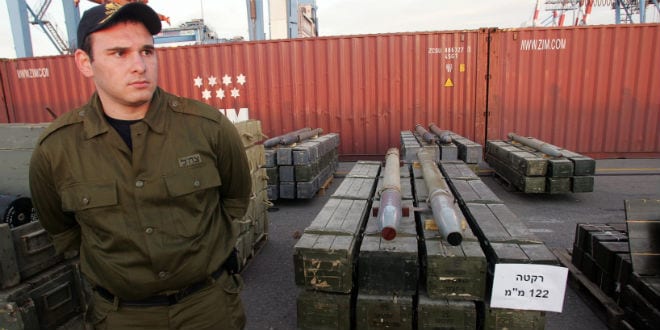 Israeli military police officers stand next to rockets seized by Israeli authorities on a ship near Cyprus, and presented in the port of the Israeli city of Ashdod, Wednesday, Nov. 4, 2009. Israeli commandos seized a ship Wednesday that defense officials said was carrying hundreds of tons of weapons from Iran bound for Lebanon's Hezbollah guerrillas, the largest arms shipment Israel has ever commandeered. (Photo: IDF Spokesperson/FLASH90)
