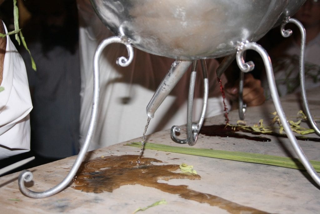 The water and wine pouring onto the stone. (Adam Propp)