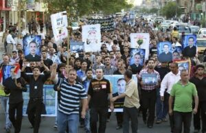 Mourners march during a funeral for victims of an attack on the Our Lady of Salvation church in Baghdad, November 2, 2010. (Photo: Thaier Al-Sudani/MEMRI)