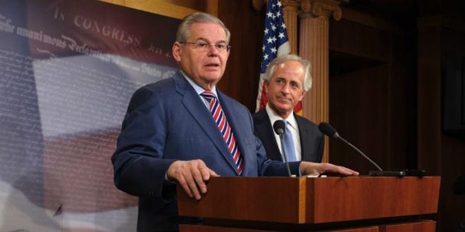 Sen. Robert Menendez (D-N.J.) speaks at a press conference in March that followed the Senate's passage of a bill on Ukraine. Looking on is Sen. Bob Corker (R-Tenn.), whose amendment proposing congressional oversight of a deal on the Iran nuclear program this month prompted Menendez, chair of the Senate Foreign Relations Committee, to withdraw the U.S.-Israel Strategic Partnership Act of 2013. (Photo: Office of Sen. Robert Menendez)