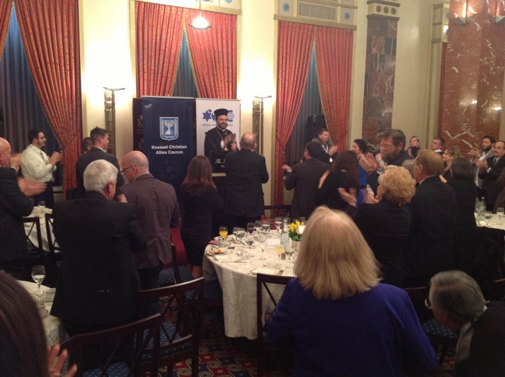 Father Gabriel Naddaf accepting his award. (Photo: Knesset Christian Allies Caucus)