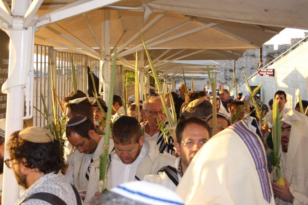 Religious Jewish men holding the "Four Species" of Sukkot wait to enter the Temple Mount compound. (Facebook Page: Students for the Temple Mount)