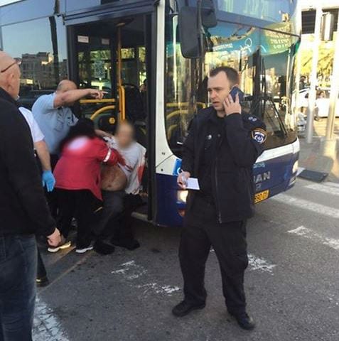 The Dan bus driver being treated at the scene. (Photo: Ynet/Twitter)